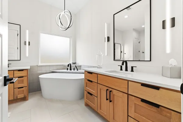 a bathroom with a sink and mirror