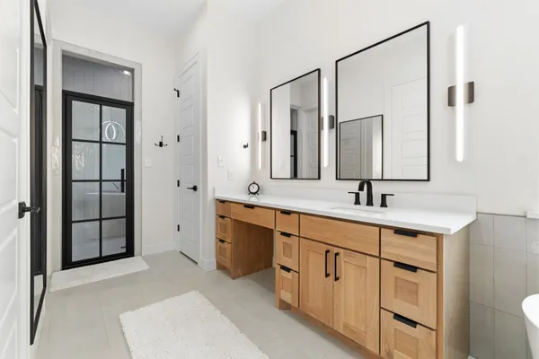 a bathroom with a shower and toilet