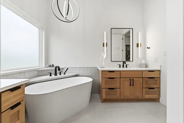 a large white bed in a white room