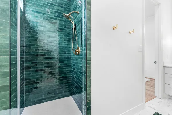 a view of a pool in a backyard