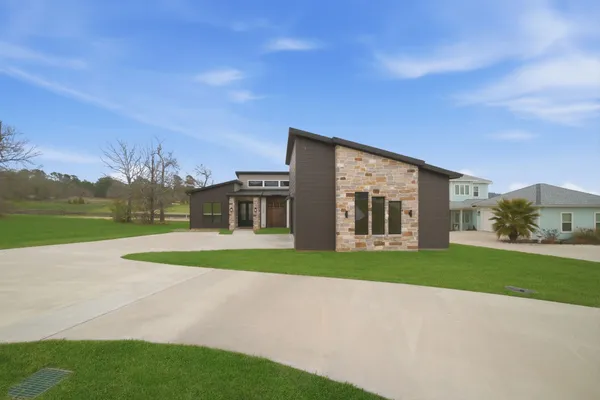 a kitchen with stainless steel appliances sink stove and cabinets