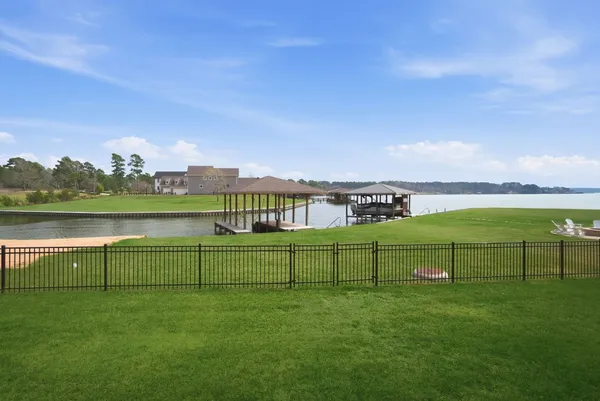 a kitchen with stainless steel appliances sink stove and cabinets