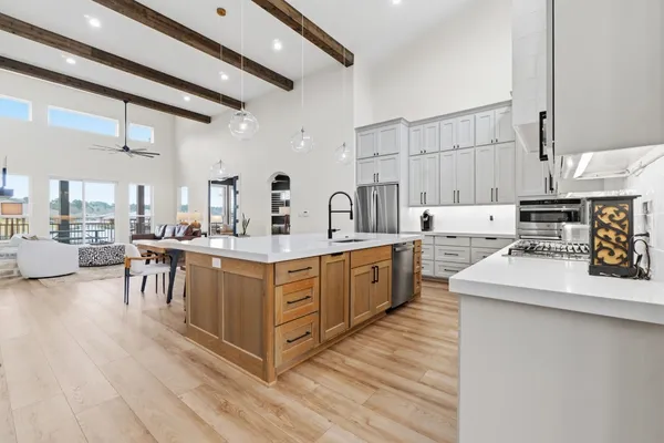 a kitchen with cabinets and appliances