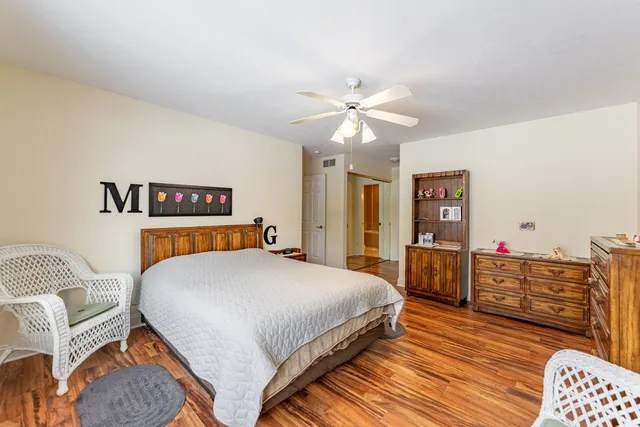 a bedroom with a bed and dresser