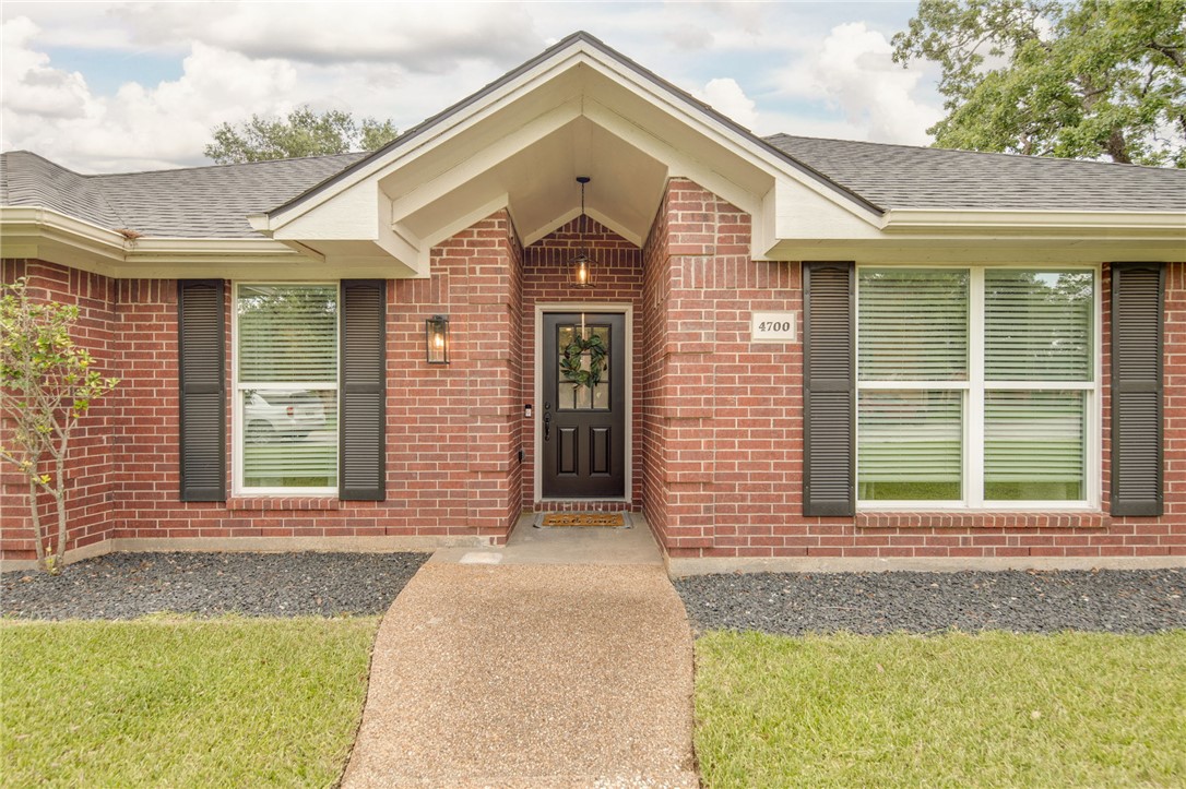 4700 Kensington Road Bryan, TX 77802 - Photo 4 of 31 Covered entry and dark shutters