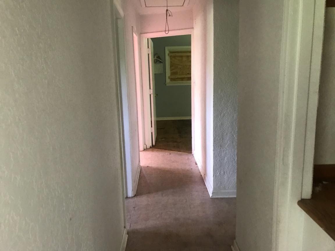 3883 Jae Valley Road Roanoke, VA 24014 - Photo 4 of 9 a view of a hallway with wooden floor and a small space