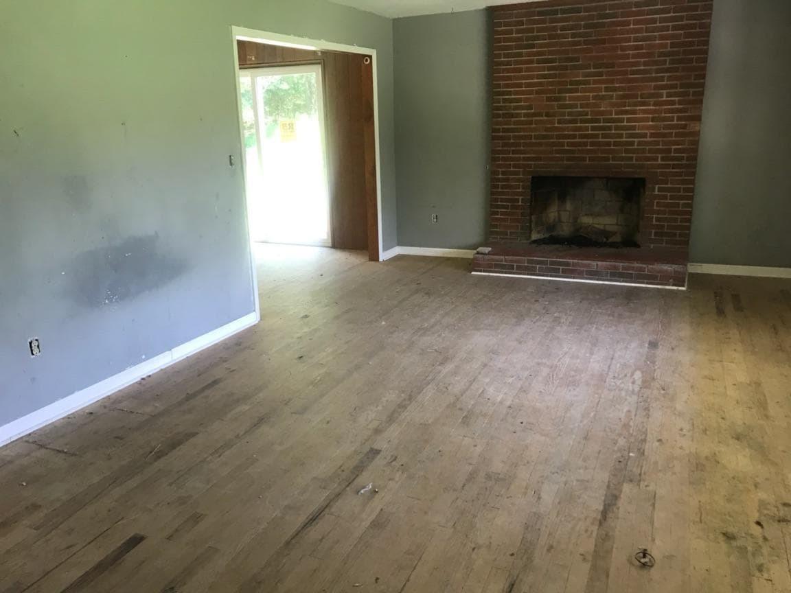 3883 Jae Valley Road Roanoke, VA 24014 - Photo 6 of 9 a view of empty room with wooden floor and fireplace