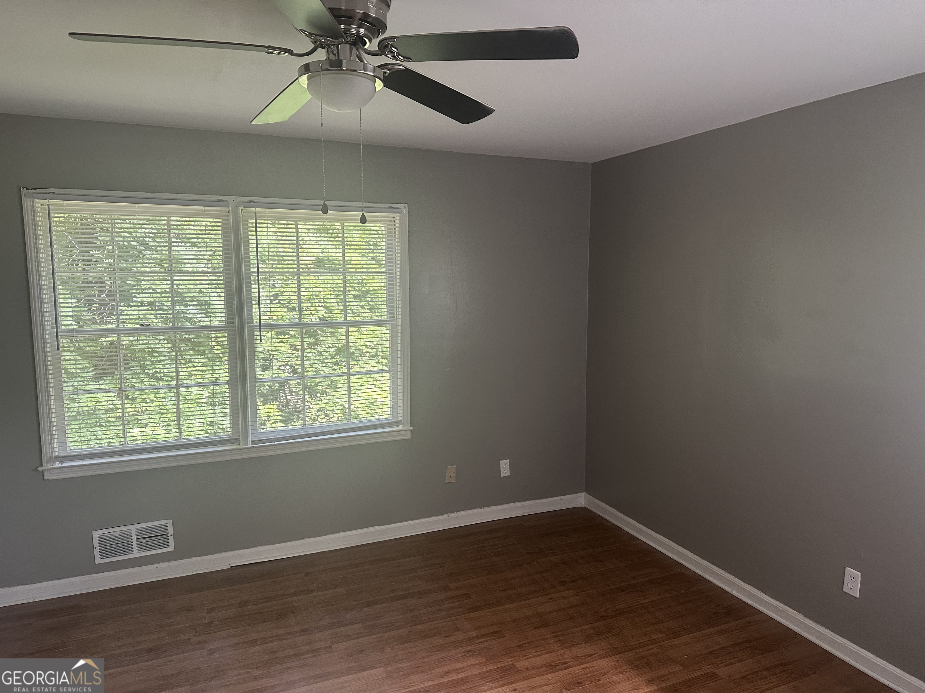 273 Fennel Way Southwest Atlanta, GA 30331 - Photo 14 of 20 a view of an empty room with wooden floor and a window