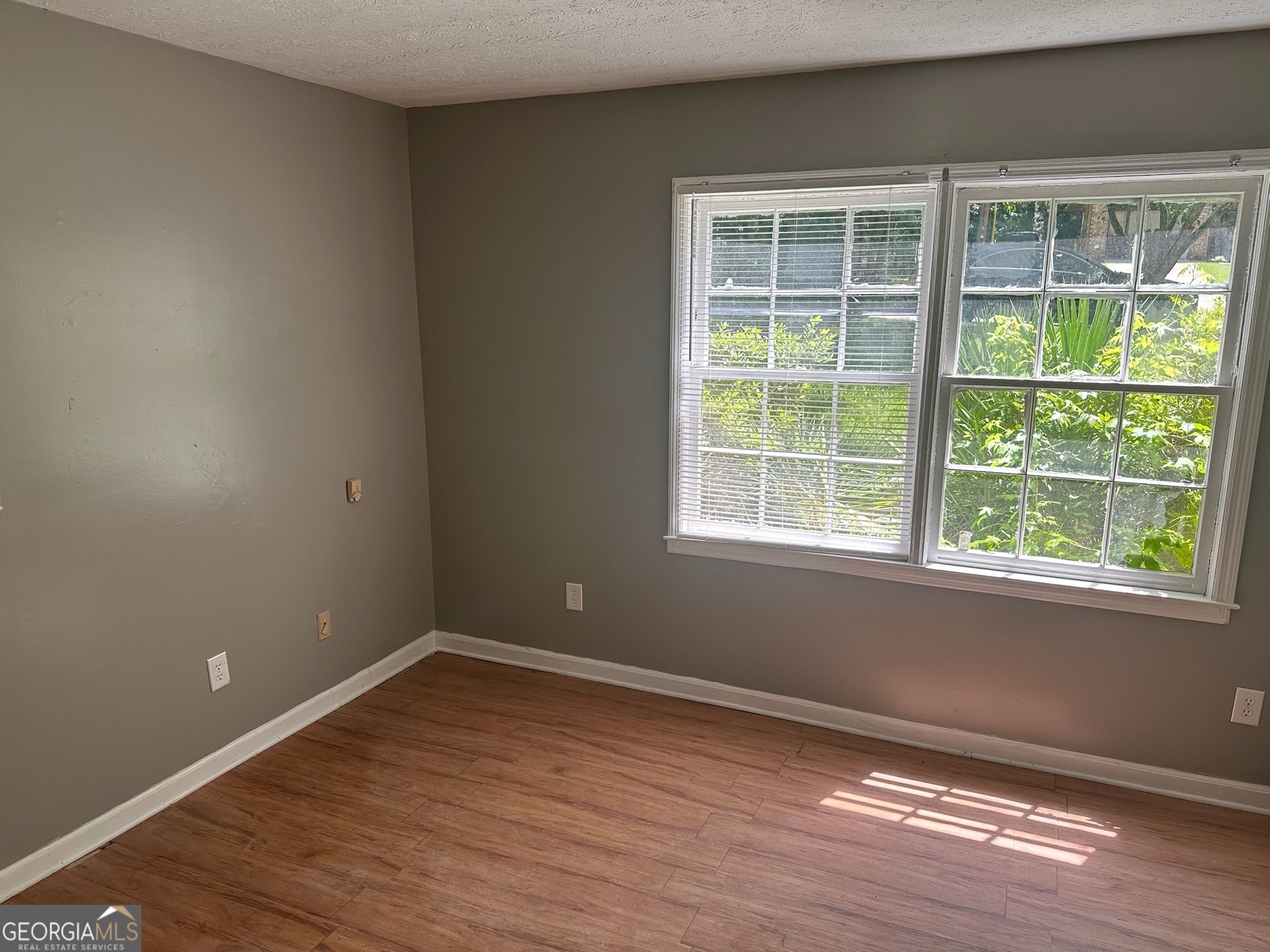 273 Fennel Way Southwest Atlanta, GA 30331 - Photo 18 of 20 a view of an empty room with wooden floor and a window