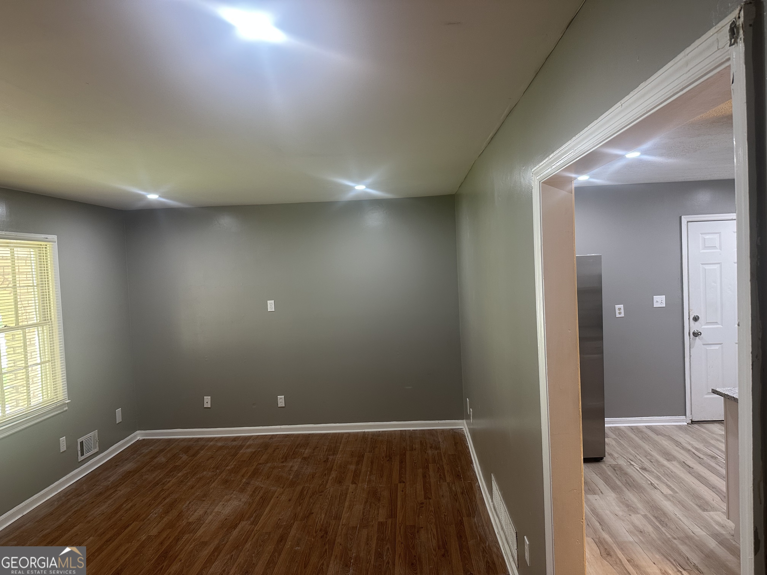 273 Fennel Way Southwest Atlanta, GA 30331 - Photo 5 of 20 wooden floor in an empty room with a window