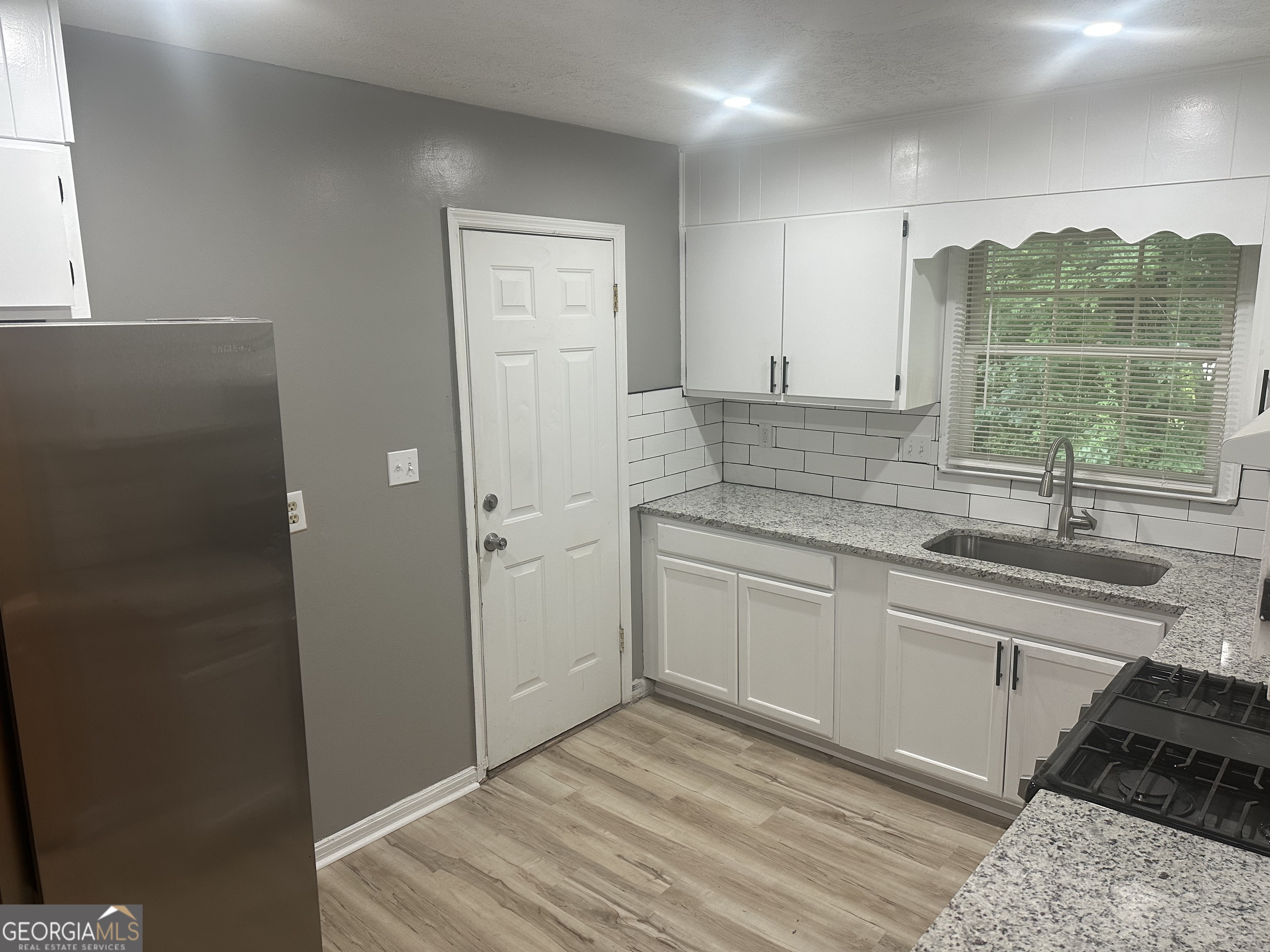 273 Fennel Way Southwest Atlanta, GA 30331 - Photo 7 of 20 a kitchen with a sink and cabinets