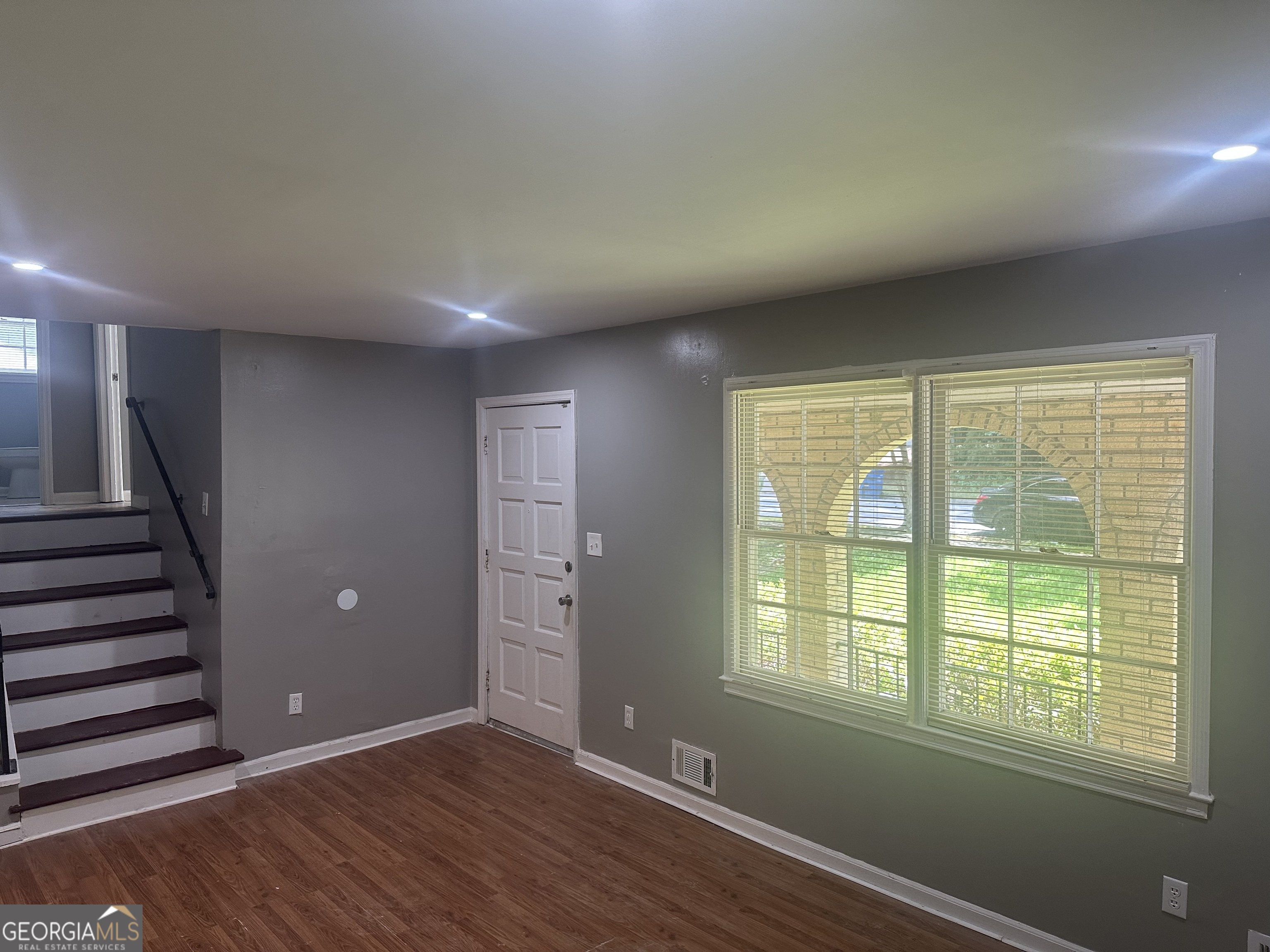 273 Fennel Way Southwest Atlanta, GA 30331 - Photo 10 of 20 wooden floor in an empty room with a window