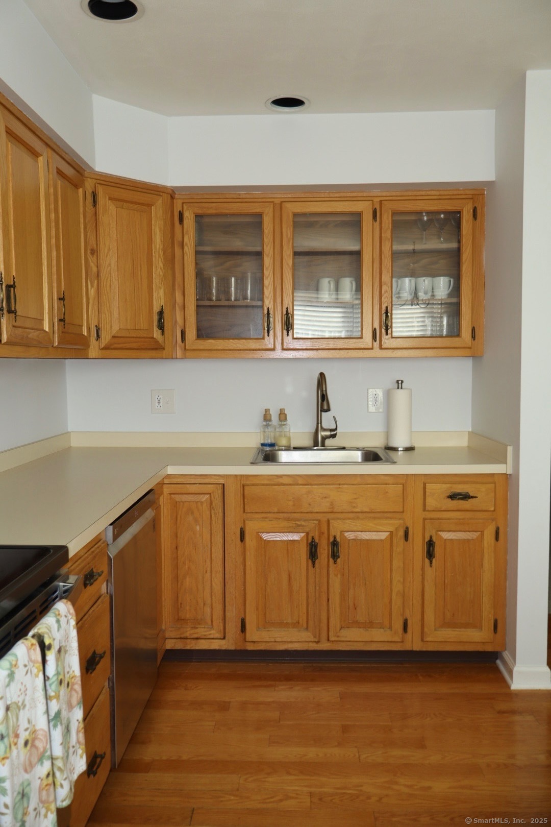 33 Stillmeadow Circle, Unit 33 Monroe, CT 06468 - Photo 12 of 14 a kitchen with stainless steel appliances granite countertop a refrigerator and cabinets
