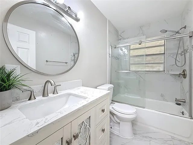 a view of backyard with wooden floor and fence