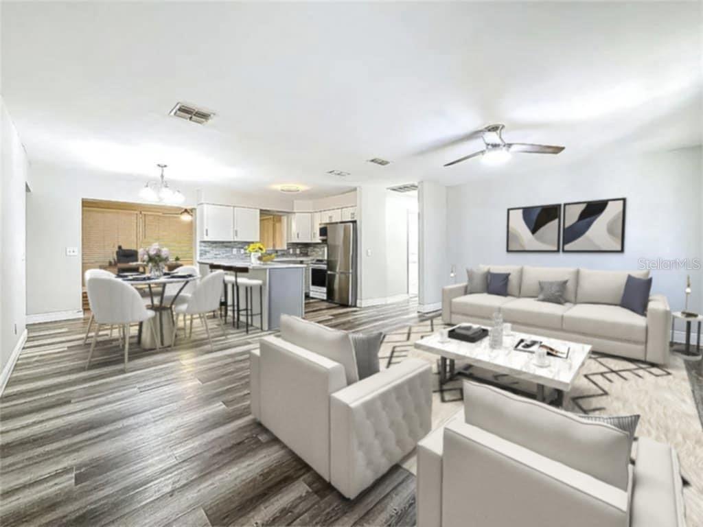1614 Braund Avenue Clearwater, FL 33756 - Photo 2 of 29 a living room with furniture and a view of kitchen