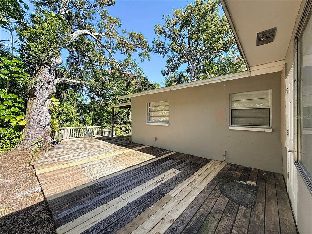 1614 Braund Avenue Clearwater, FL 33756 - Photo 21 of 29 a view of backyard with wooden floor and fence