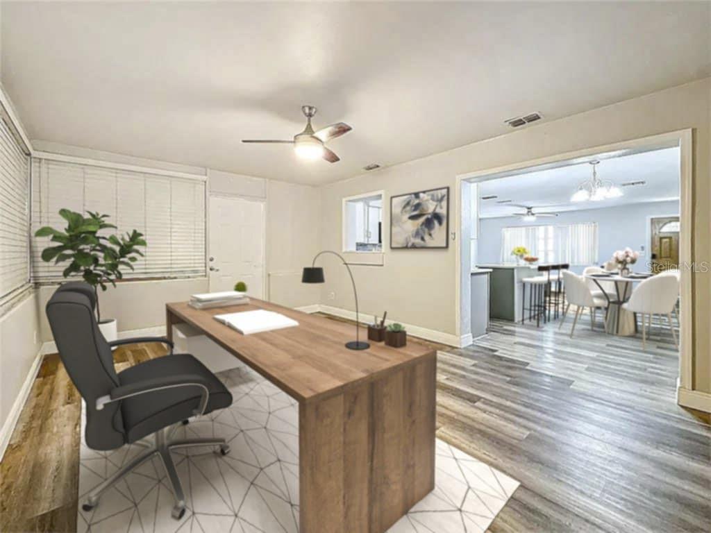 1614 Braund Avenue Clearwater, FL 33756 - Photo 4 of 29 a view of a dining room with furniture and wooden floor