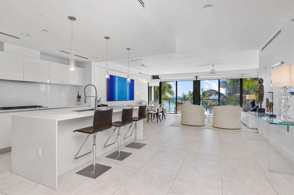 2101 South Surf Road, Unit 4C Hollywood, FL 33019 - Photo 22 of 55 a kitchen with counter top space cabinets and stainless steel appliances