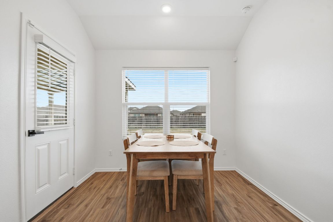 287 George Neggan Lane Bastrop, TX 78602 - Photo 7 of 26 a view of a workspace with furniture and a window