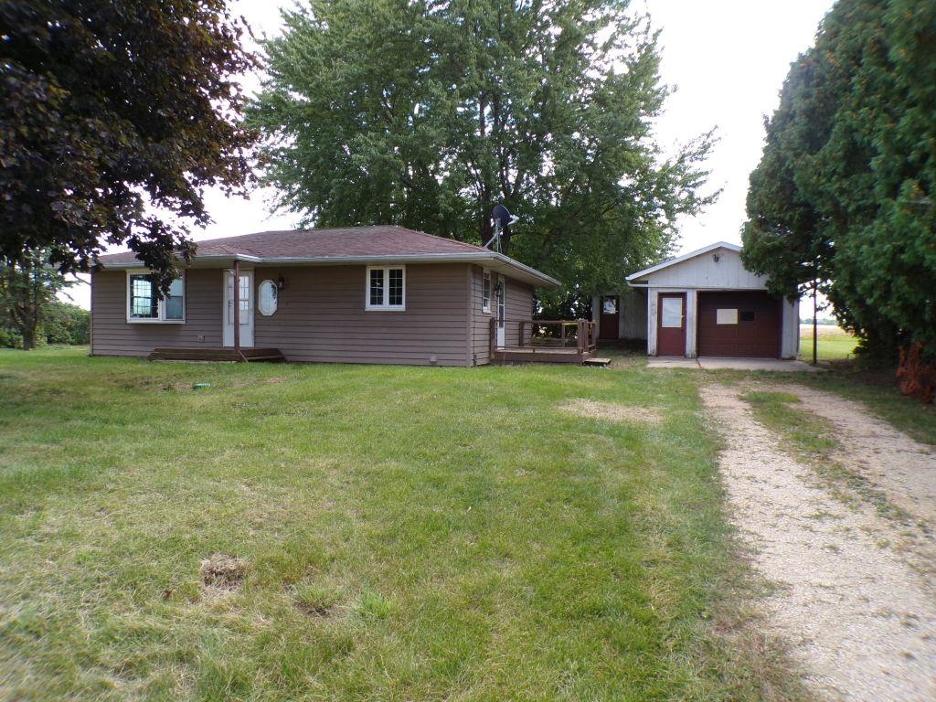 5779 Town Line Road Leaf River, IL 61047 - Photo 1 of 14 a view of a yard in front of the house
