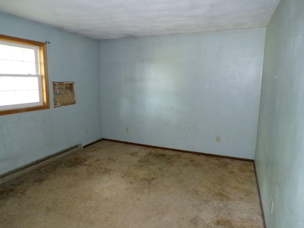 5779 Town Line Road Leaf River, IL 61047 - Photo 7 of 14 an empty room with a window