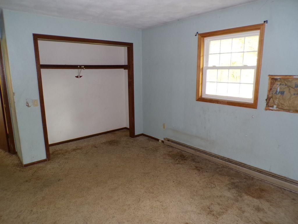 5779 Town Line Road Leaf River, IL 61047 - Photo 8 of 14 an empty room with a window