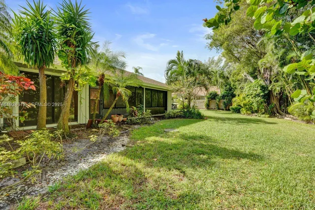 a kitchen with stainless steel appliances granite countertop a stove and a refrigerator