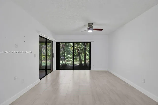a view of an empty room with a balcony