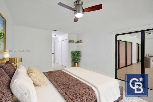 a view of an empty room with glass door