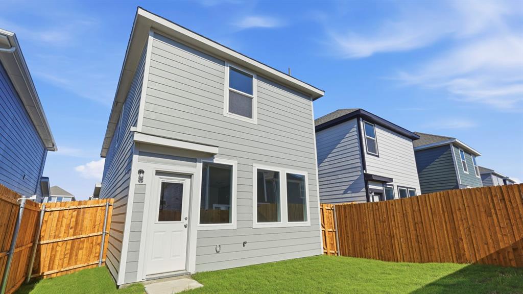 321 Tall Cedar Way Princeton, TX 75407 - Photo 4 of 8 a view of a house with wooden fence