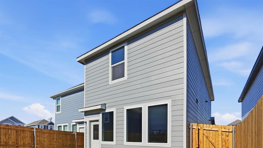 321 Tall Cedar Way Princeton, TX 75407 - Photo 5 of 8 a view of a house with wooden fence