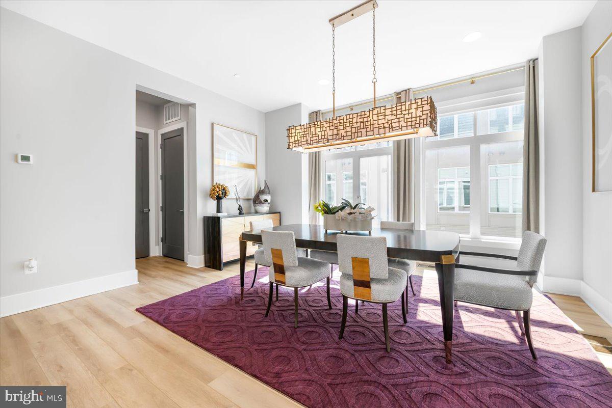 8197 River Road Bethesda, MD 20817 - Photo 11 of 53 a view of a dining room with furniture