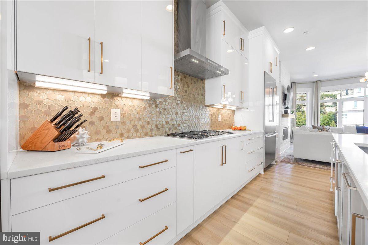 8197 River Road Bethesda, MD 20817 - Photo 14 of 53 a kitchen with white cabinets and window