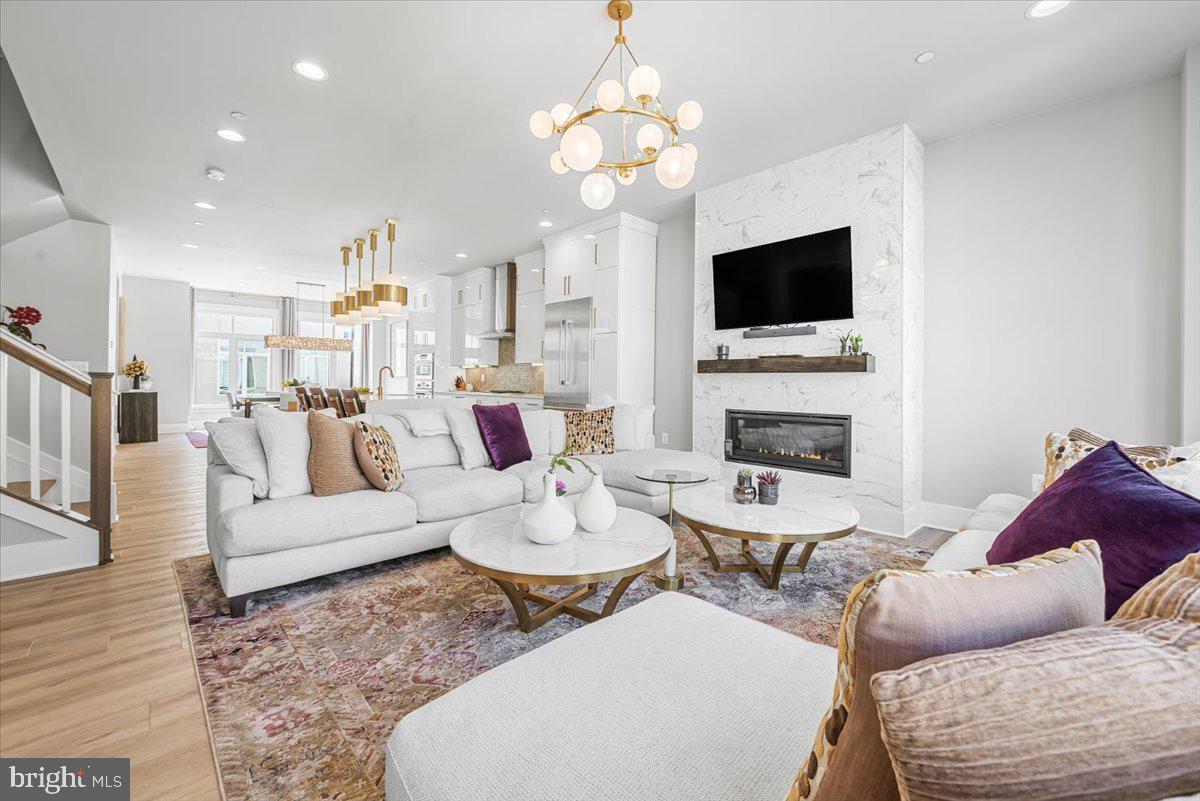 8197 River Road Bethesda, MD 20817 - Photo 20 of 53 a living room with fireplace furniture and a flat screen tv