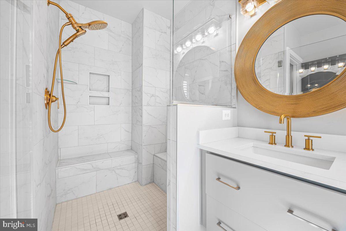 8197 River Road Bethesda, MD 20817 - Photo 25 of 53 a bathroom with a sink and a mirror