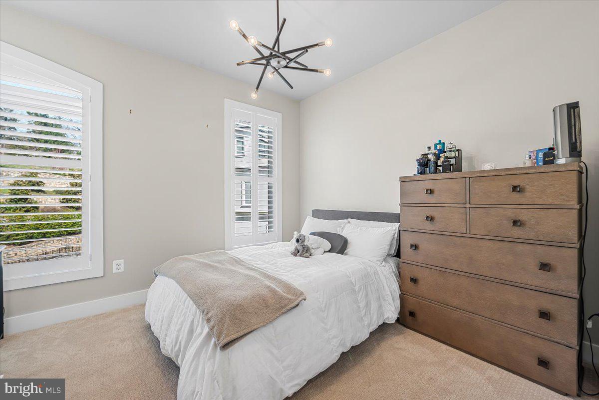 8197 River Road Bethesda, MD 20817 - Photo 27 of 53 a bedroom with a bed and a window