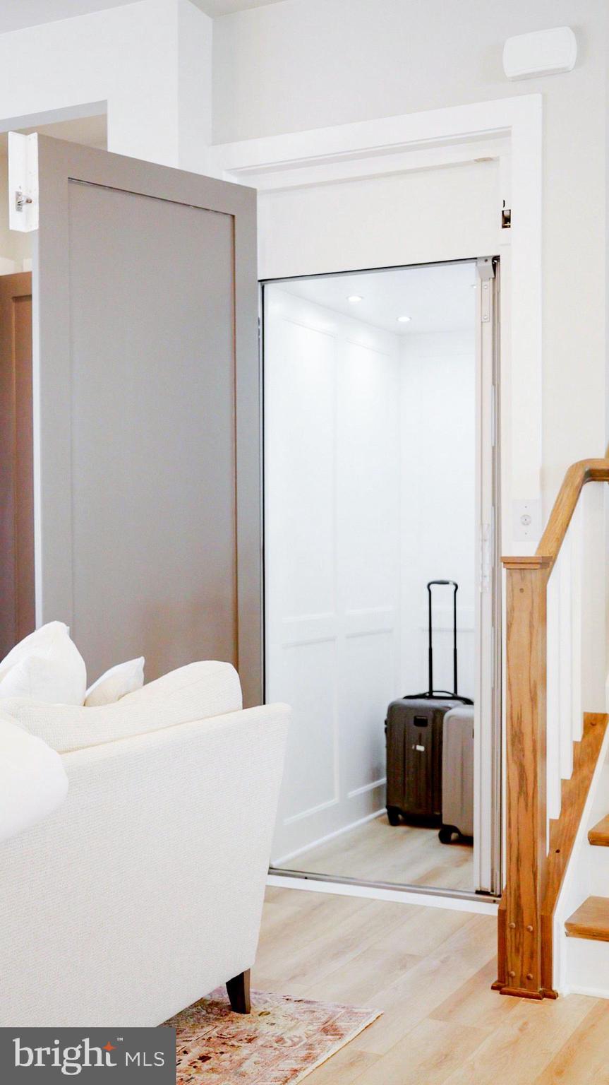 8197 River Road Bethesda, MD 20817 - Photo 31 of 53 a living room with a couch and a table