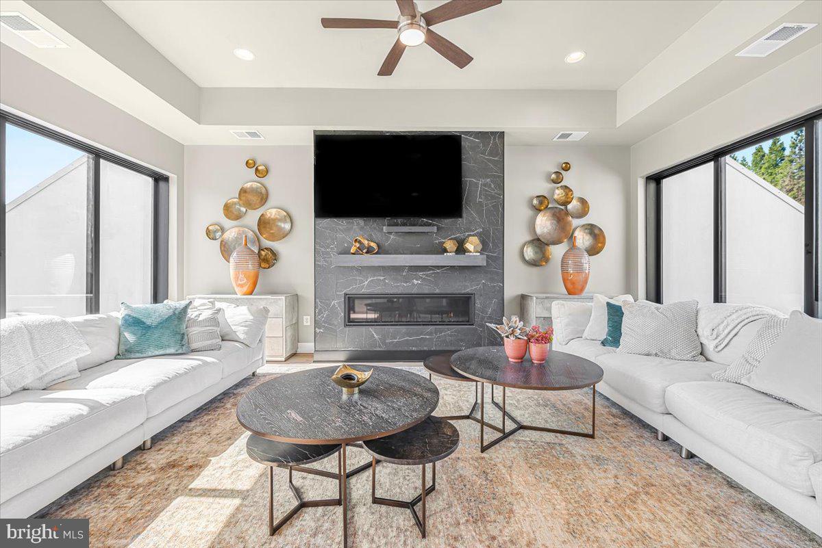 8197 River Road Bethesda, MD 20817 - Photo 34 of 53 a living room with furniture and a flat screen tv