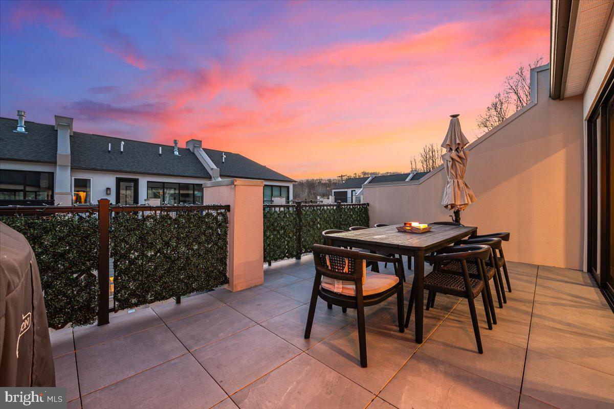 8197 River Road Bethesda, MD 20817 - Photo 40 of 53 a backyard of a house with table and chairs