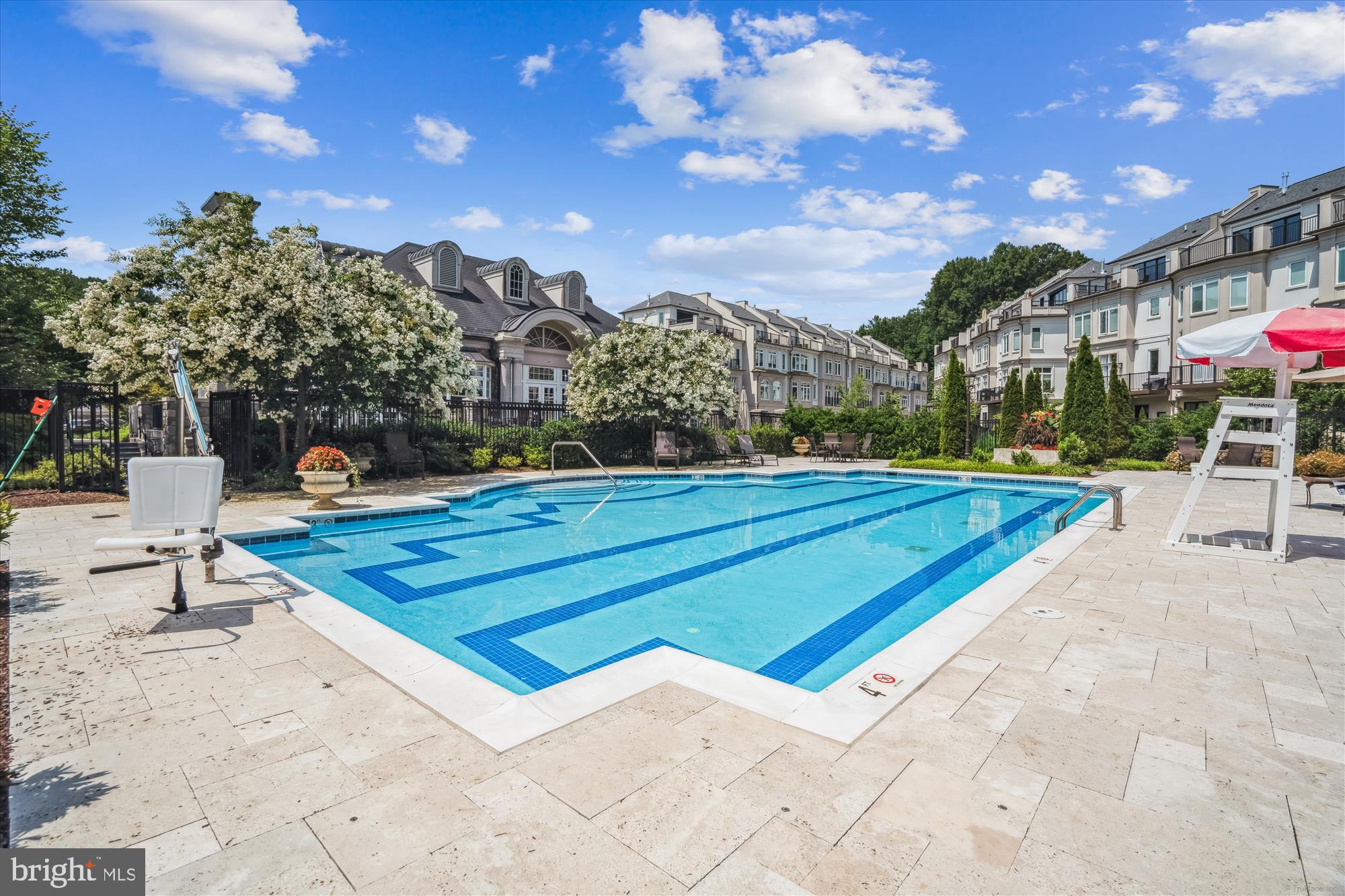 8197 River Road Bethesda, MD 20817 - Photo 42 of 53 a swimming pool with outdoor seating and yard in the back