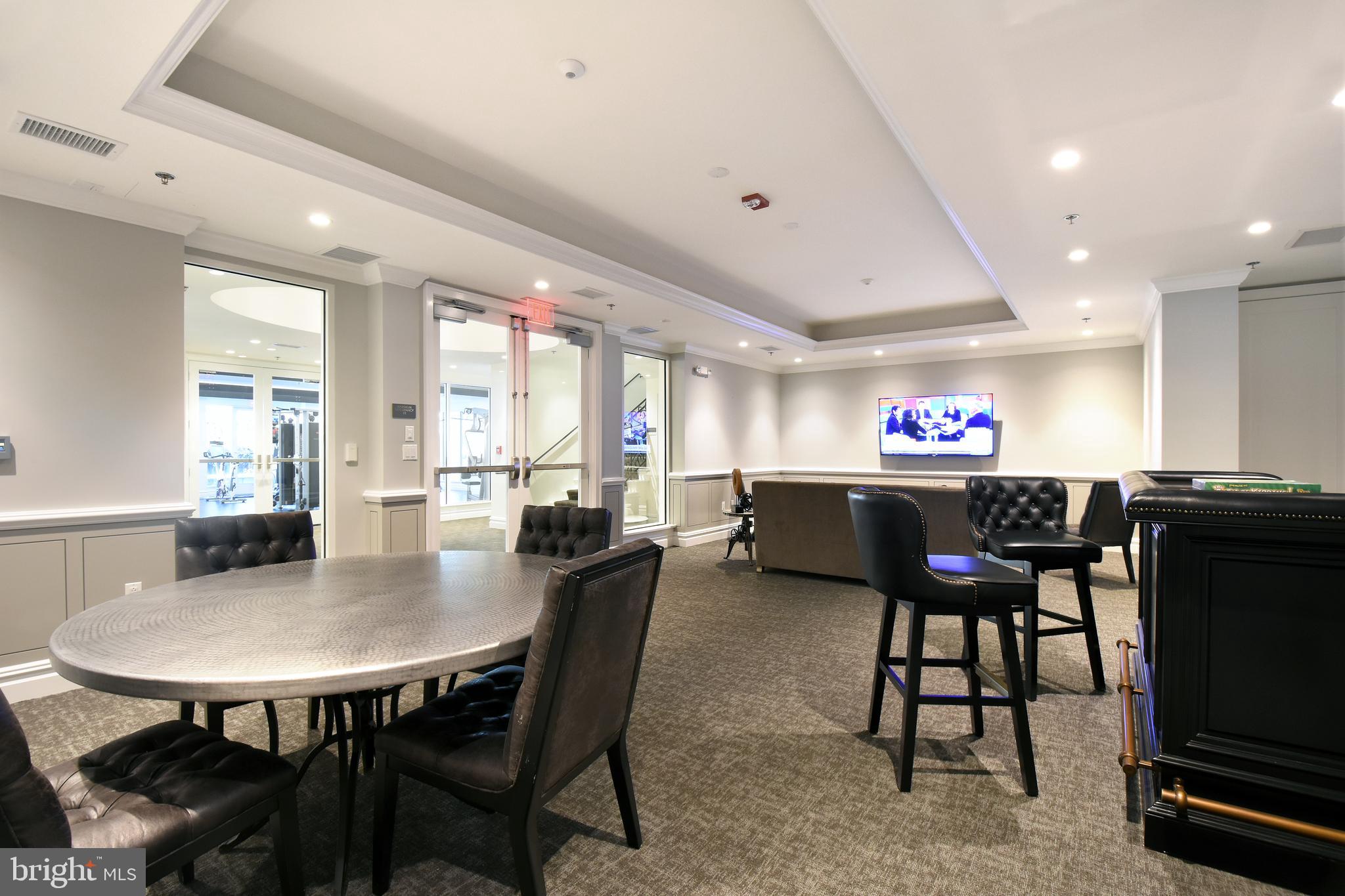 8197 River Road Bethesda, MD 20817 - Photo 46 of 53 a view of a dining room with furniture and a potted plant