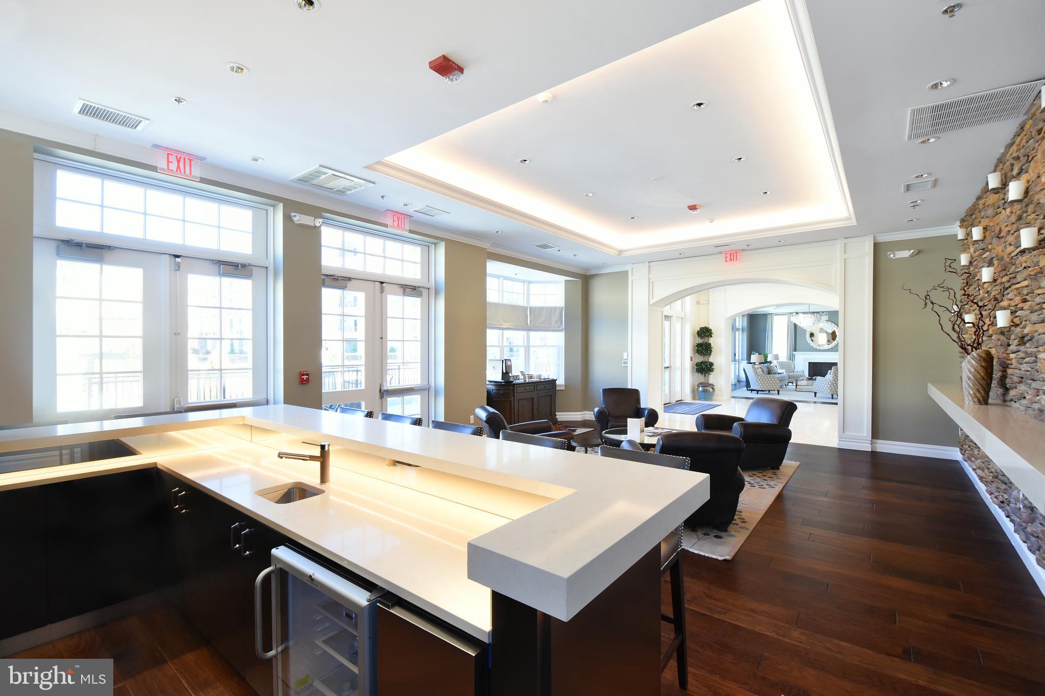 8197 River Road Bethesda, MD 20817 - Photo 49 of 53 a large kitchen with kitchen island a sink a counter space and appliances
