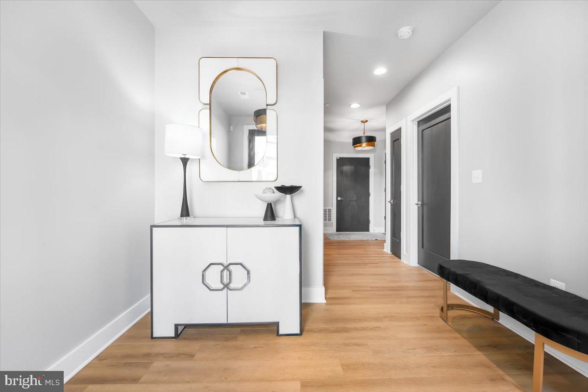 8197 River Road Bethesda, MD 20817 - Photo 6 of 53 a bathroom with a sink a mirror and shower