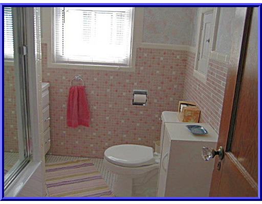 31 Lovell Road Watertown, MA 02472 - Photo 9 of 11 a bathroom with a toilet a sink and a window