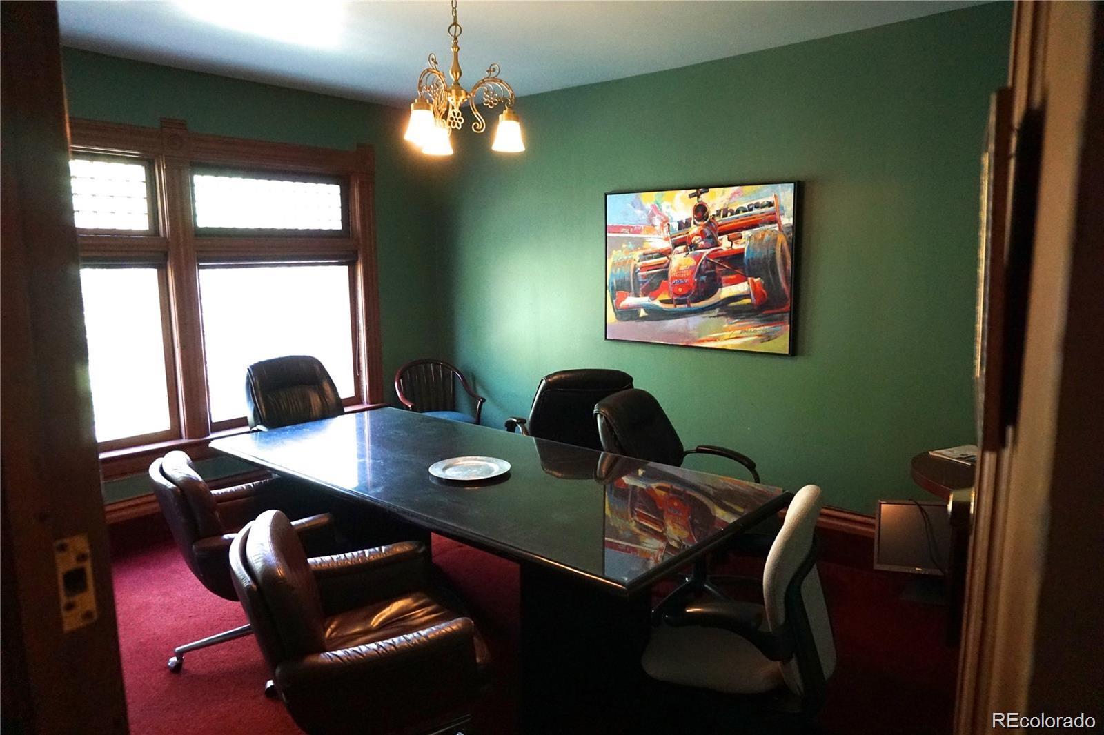 1444 Stuart Street Denver, CO 80204 - Photo 13 of 23 a view of a workspace with furniture and window