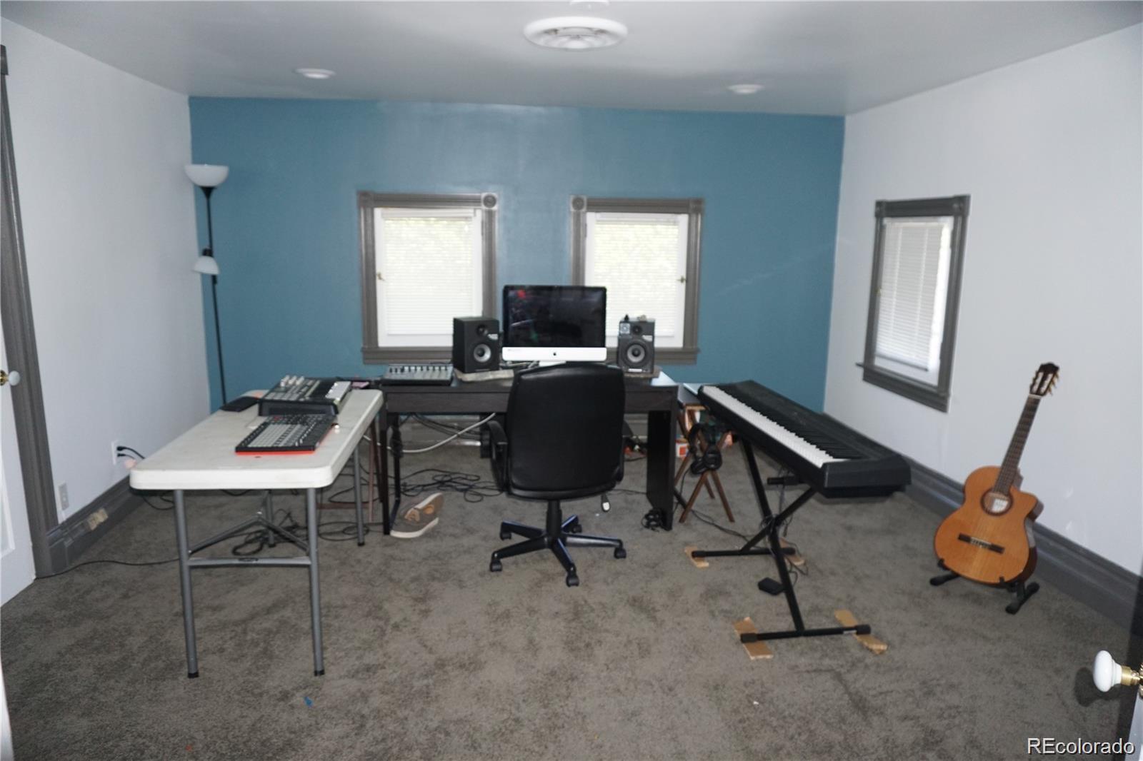 1444 Stuart Street Denver, CO 80204 - Photo 17 of 23 a view of a workspace with furniture and a window