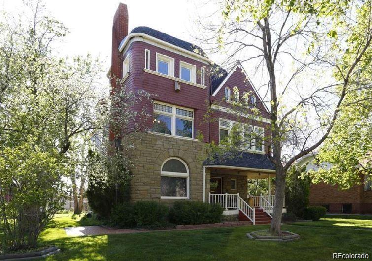 1444 Stuart Street Denver, CO 80204 - Photo 2 of 23 a front view of a house with garden
