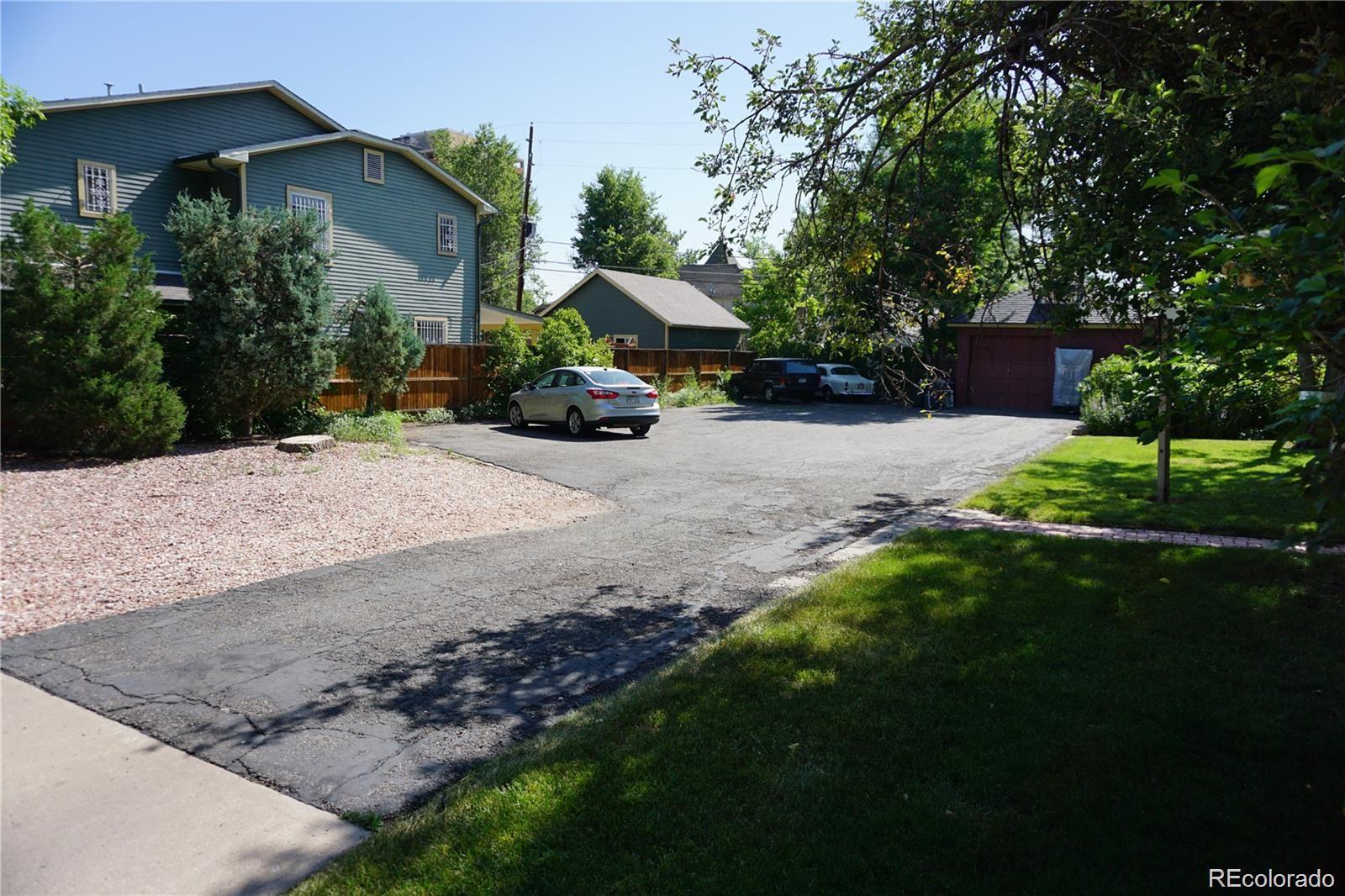 1444 Stuart Street Denver, CO 80204 - Photo 6 of 23 a view of a house with backyard and garden
