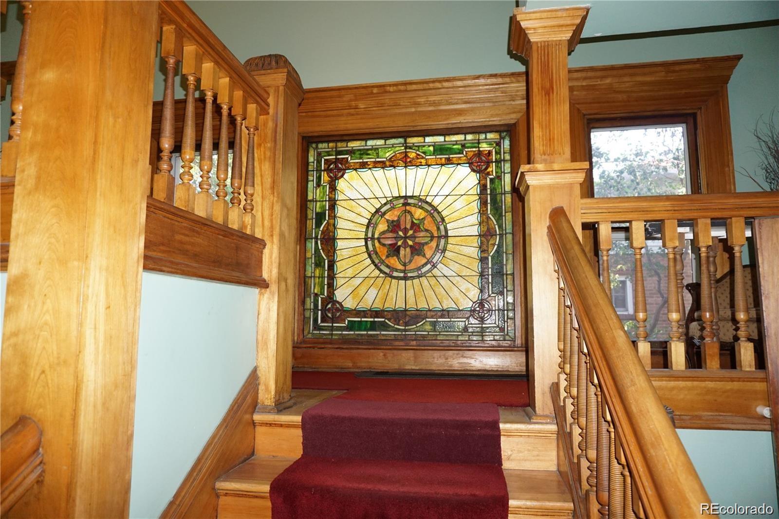 1444 Stuart Street Denver, CO 80204 - Photo 8 of 23 a view of stairs and with wooden floor