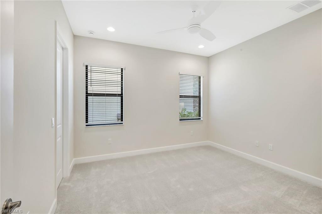 21023 Teak Tree Terrace Estero, FL 33928 - Photo 16 of 21 an empty room with windows and closet